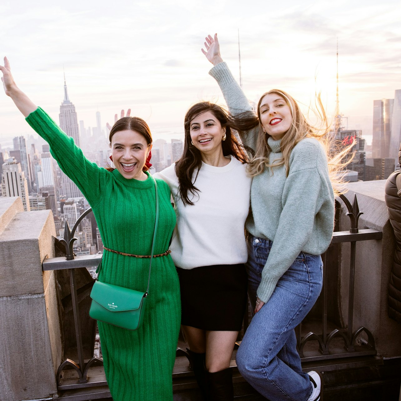 Experience breathtaking views of Manhattan from the Top of the Rock where laughter and joy mingle with stunning cityscapes perfect for unforgettable memories with friends.